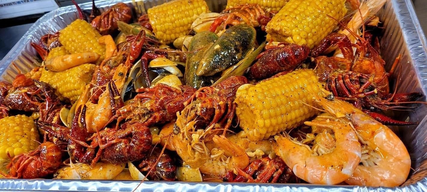 Boil Bay seafood boil with crawfish, corn, and shrimp